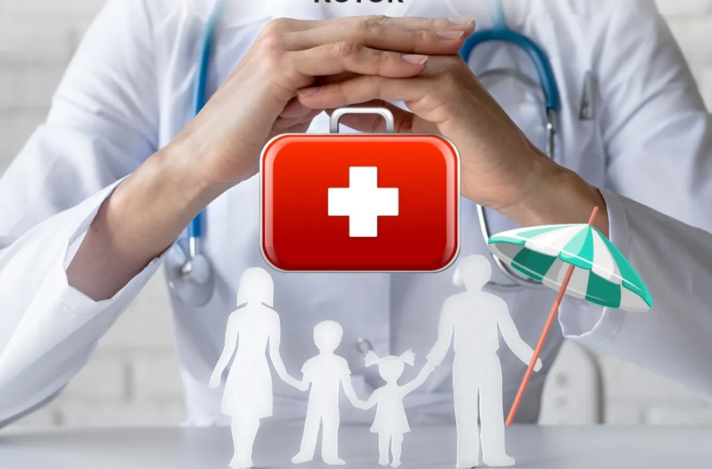 Doctor silhouette with stethoscope above family cutouts and medical kit symbol, representing healthcare protection.