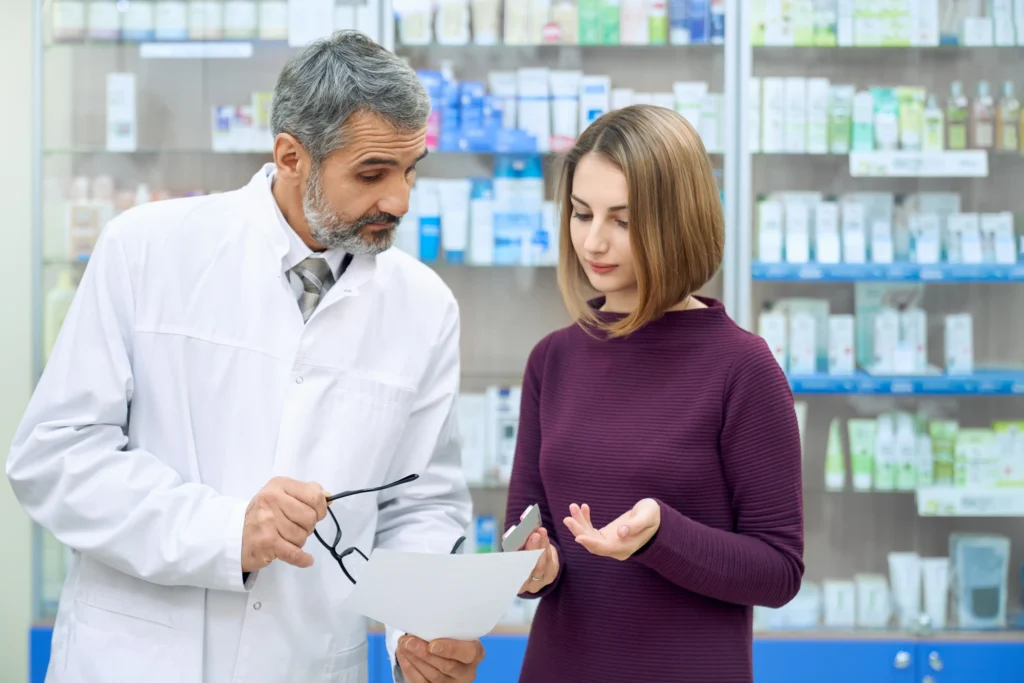 pharmacist explaining prescription to a woman
