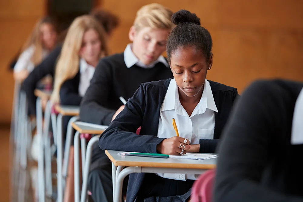 Students taking written exam in classroom at Yatton Pharmacy in Yatton, Bristol