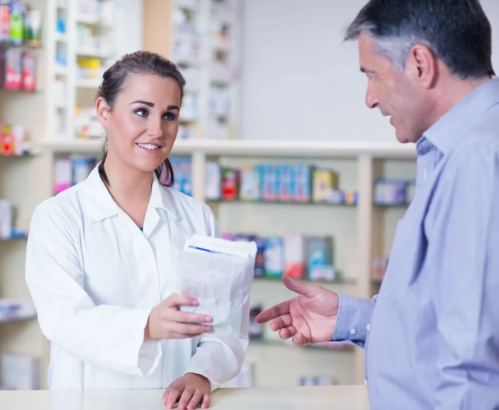 Customer receiving medicine at counter